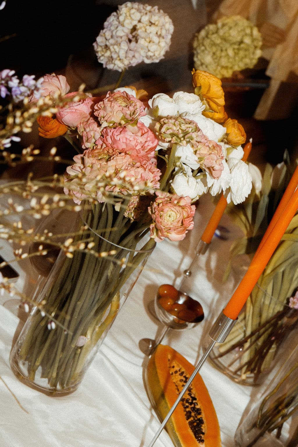 Seasonal flowers displayed in glass vases during the workshop